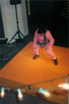 Darcy in Muscle Man outfit on stage